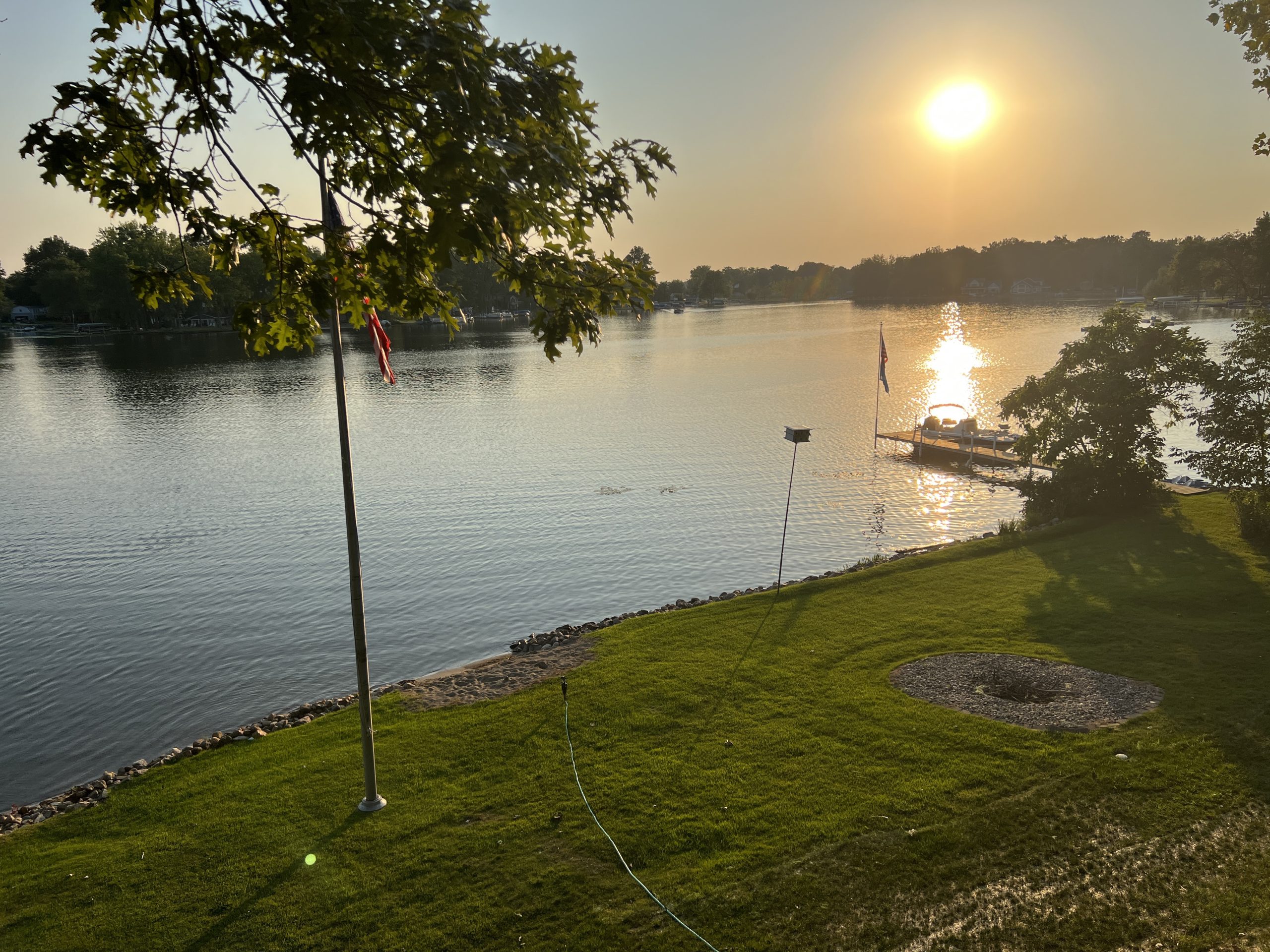 View from our deck overlooking Lake Sechrist, with the Sun setting in the background.