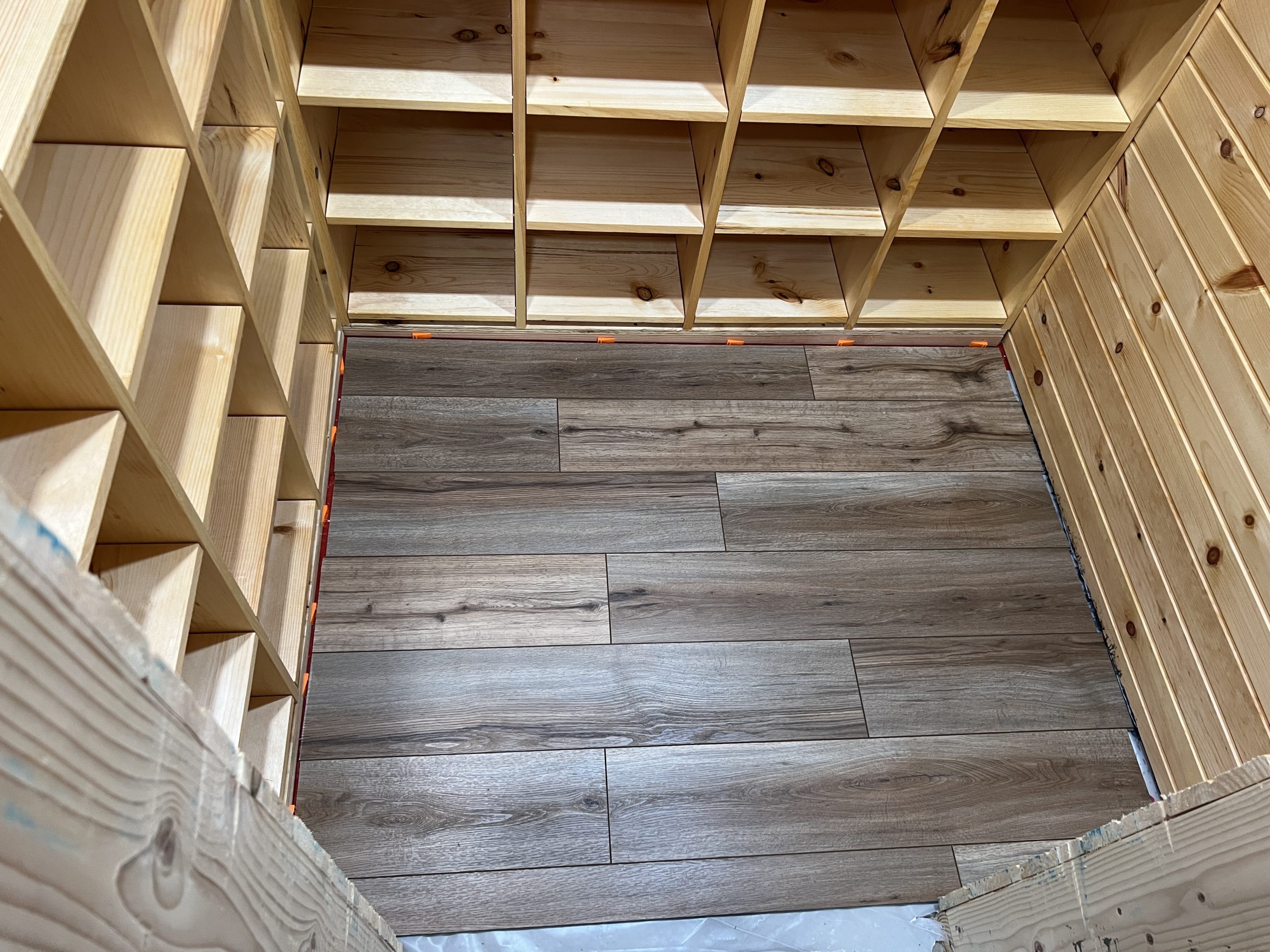 A floating snap-together vinyl plank floor, installed in the wine cellar. The flooring is meant to look like oak, and looks surprisingly realistic. 